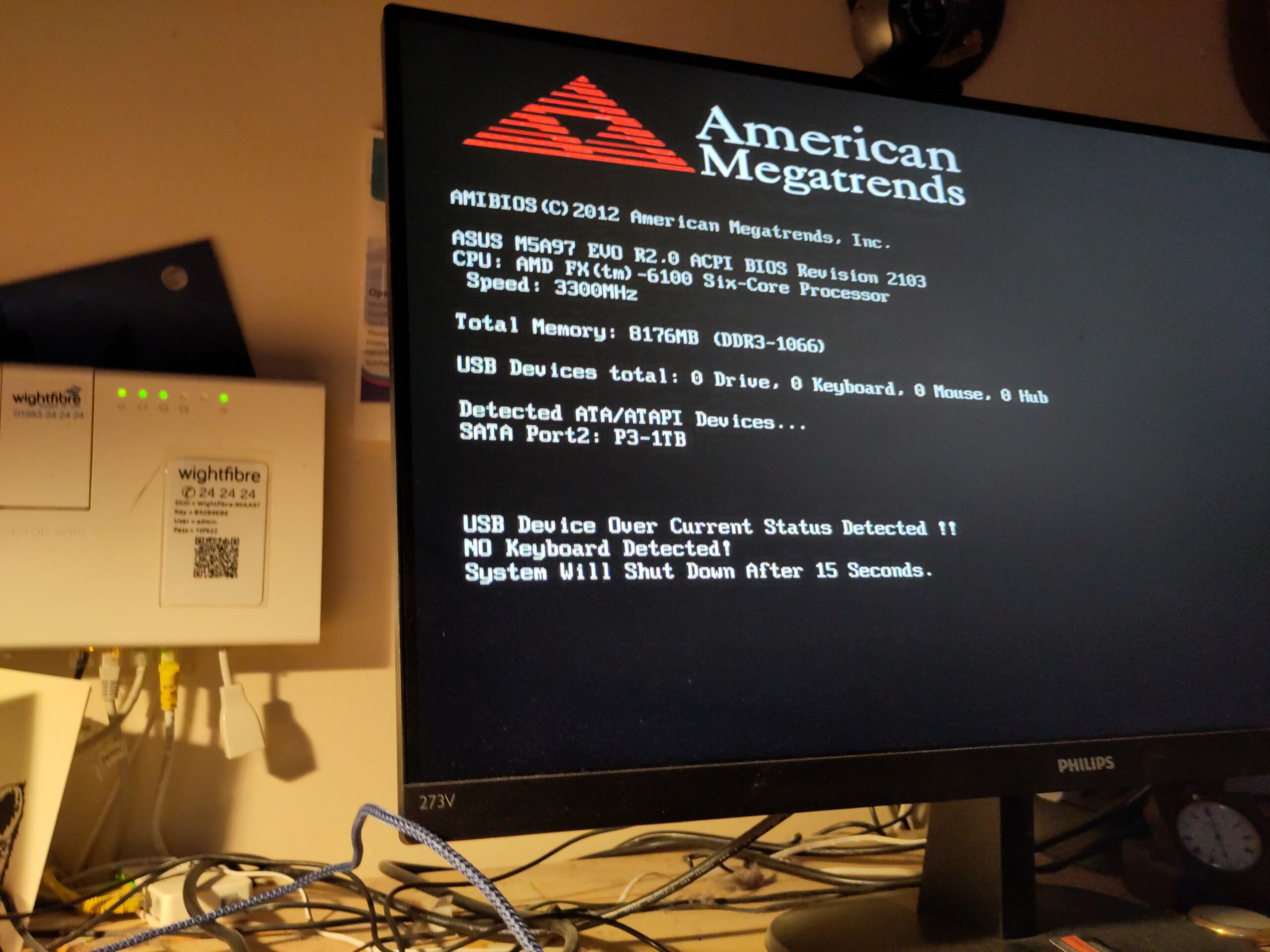 A computer monitor displays a BIOS error message, indicating that the motherboard is dead.